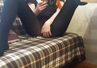 Girl in black pantyhose playing and teasing