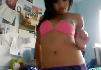 Hot asian teen strips and fingers her pussy