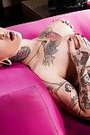 Busty tattooed babe Burning Angel playing with her shaved teen pussy