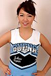 Amateur Asian solo girl sheds cheerleader uniform to bare tiny teen tits