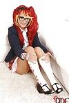 Foxy schoolgirl in glasses and fancy uniform uncovering her petite curves